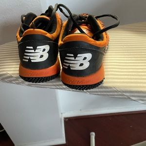 Mens turf baseball cleats. Orange and black in color. Used one season.